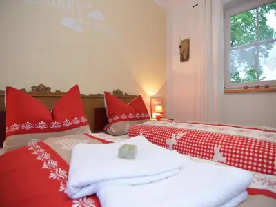 Ein Bett oder Betten in einem Zimmer der Unterkunft Ferienwohnung in Halblech