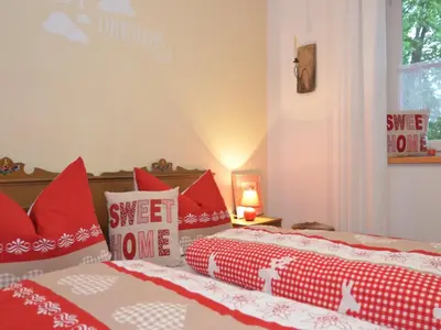 Ein Bett oder Betten in einem Zimmer der Unterkunft Ferienwohnung in Halblech