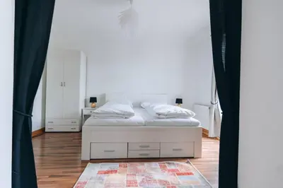 Ein Bett oder Betten in einem Zimmer der Unterkunft Große 4-Zimmer-Wohnung in der Ingolstädter City.