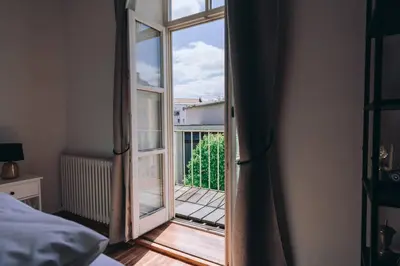 Ein Bett oder Betten in einem Zimmer der Unterkunft Große 4-Zimmer-Wohnung in der Ingolstädter City.