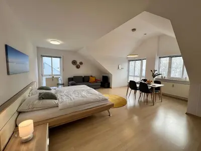 Ein Bett oder Betten in einem Zimmer der Unterkunft DG-Wohnung in Waldkraiburg 50qm