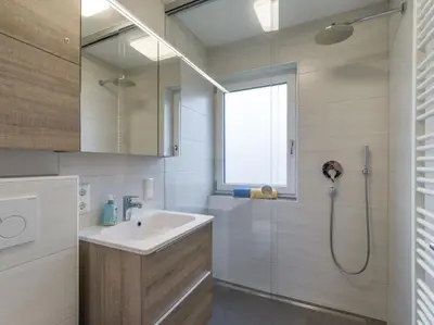 Ein Badezimmer in der Unterkunft Chiemgau Comfort C3 Ferienwohnanlage Oberaudorf mit Hallenbad und Sauna