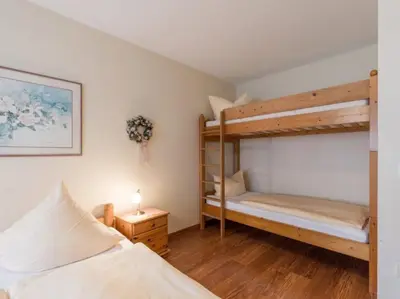 Ein Bett oder Betten in einem Zimmer der Unterkunft Chiemgau-Comfort B2 Ferienwohnanlage Oberaudorf mit Indoor Pool und Sauna