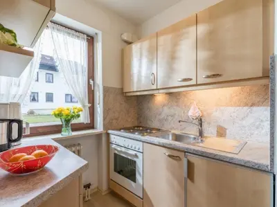 Küche/Küchenzeile in der Unterkunft Chiemgau-Comfort B2 Ferienwohnanlage Oberaudorf mit Indoor Pool und Sauna