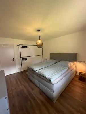 Ein Bett oder Betten in einem Zimmer der Unterkunft Ferienwohnung Bergrausch