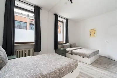 Ein Bett oder Betten in einem Zimmer der Unterkunft 90m2 in Münchener Innenstadt