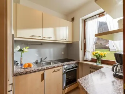 Küche/Küchenzeile in der Unterkunft Chiemgau Comfort A2 Ferienwohnanlage Oberaudorf mit Hallenbad und Sauna