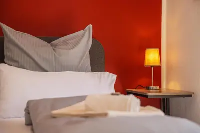 Ein Bett oder Betten in einem Zimmer der Unterkunft Moderne Maisonette mit Garten
