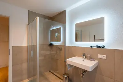 Ein Badezimmer in der Unterkunft Design-Apartment in Langenbach bei München, nahe Flughafen München
