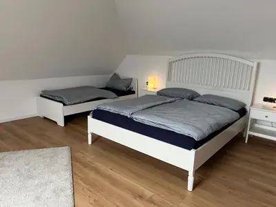 Ein Bett oder Betten in einem Zimmer der Unterkunft Gemütliche 90qm Wohnung am Waldrand