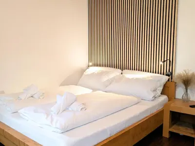 Ein Bett oder Betten in einem Zimmer der Unterkunft Neu! Moderner bayrischer Flair vor Pilatushaus