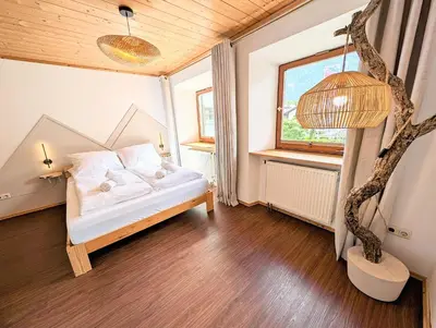 Ein Bett oder Betten in einem Zimmer der Unterkunft Neu! Moderner bayrischer Flair vor Pilatushaus