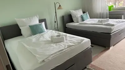 Ein Bett oder Betten in einem Zimmer der Unterkunft Oase1 mit Parkplatz, Automatische Kaffeemaschine und Küche