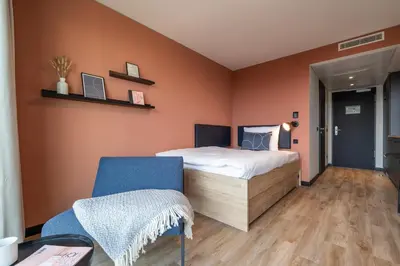 Ein Bett oder Betten in einem Zimmer der Unterkunft The Base Munich