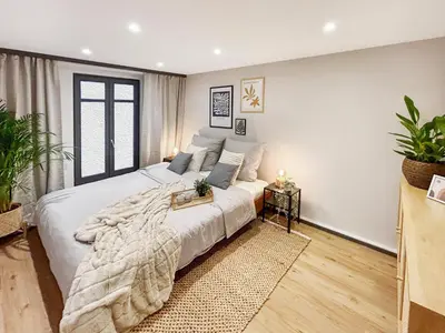 Ein Bett oder Betten in einem Zimmer der Unterkunft Gemütliche Oase in der Innenstadt, zwei Minuten zum Rathaus