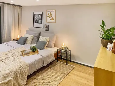 Ein Bett oder Betten in einem Zimmer der Unterkunft Gemütliche Oase in der Innenstadt, zwei Minuten zum Rathaus