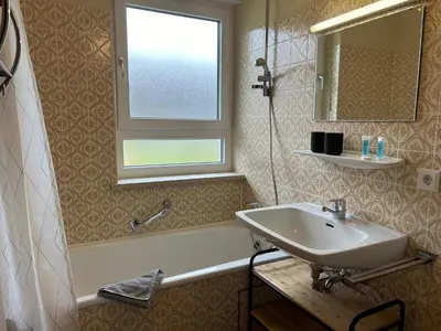 Ein Badezimmer in der Unterkunft Chiemgau Comfort F4 Ferienwohnanlage Oberaudorf mit Hallenbad und Sauna