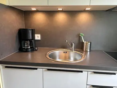 Küche/Küchenzeile in der Unterkunft Chiemgau Comfort F4 Ferienwohnanlage Oberaudorf mit Hallenbad und Sauna