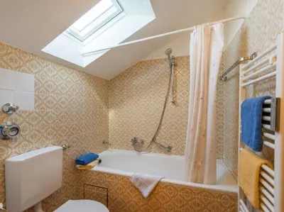 Ein Badezimmer in der Unterkunft Chiemgau Comfort A8 Ferienwohnanlage Oberaudorf mit Hallenbad und Sauna
