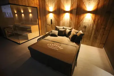 Ein Bett oder Betten in einem Zimmer der Unterkunft Griabig Lodge mit Sauna und Wellnessbereich