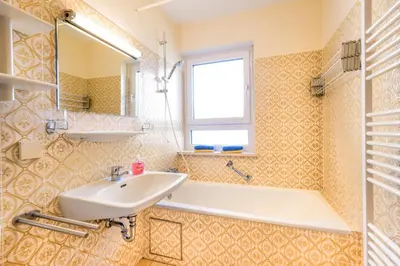 Ein Badezimmer in der Unterkunft Chiemgau Comfort C6 Ferienwohnanlage Oberaudorf mit Hallenbad und Sauna