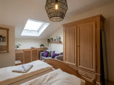 Ein Bett oder Betten in einem Zimmer der Unterkunft Chiemgau Comfort B7 Ferienwohnanlage Oberaudorf mit Indoor Pool und Sauna