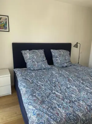 Ein Bett oder Betten in einem Zimmer der Unterkunft Wunderschönes 4 Zimmer Apartment mit Seeblick