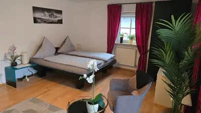 Ein Bett oder Betten in einem Zimmer der Unterkunft Ferienhaus Weilheim mit Garten Spiel und Spass
