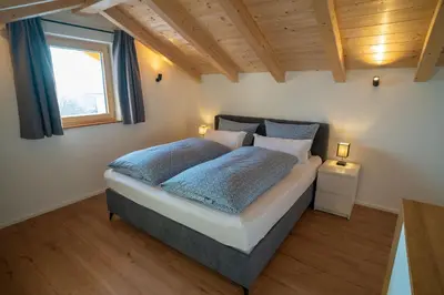 Ein Bett oder Betten in einem Zimmer der Unterkunft Ferienwohnung Osterbach