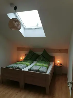 Ein Bett oder Betten in einem Zimmer der Unterkunft Tag-Hof