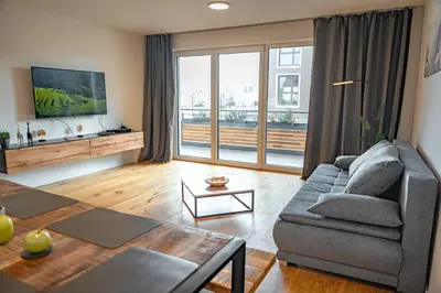Ein Sitzbereich in der Unterkunft ApartHome Eching near Munich Airport