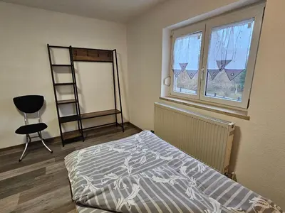 Ein Bett oder Betten in einem Zimmer der Unterkunft Bei München Ferienwohnung in Grafrath Amperschlucht