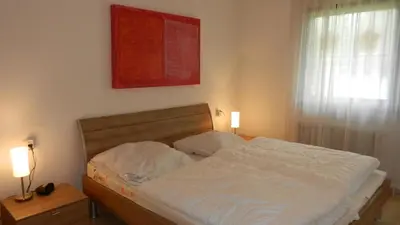 Ein Bett oder Betten in einem Zimmer der Unterkunft Lechbruck am See Feriendorf Hochbergle Haus 135
