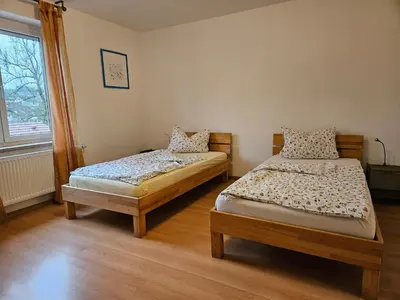 Ein Bett oder Betten in einem Zimmer der Unterkunft Bei München Ferienwohnung in Grafrath 