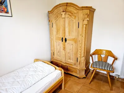 Ein Bett oder Betten in einem Zimmer der Unterkunft Lechbruck am See Feriendorf Hochbergle Haus 26