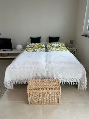 Ein Bett oder Betten in einem Zimmer der Unterkunft Ferienwohnung IDA