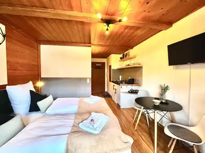 Ein Bett oder Betten in einem Zimmer der Unterkunft Ferienwohnung Alpenglühen - mit Sauna & Frühstück