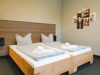 Ein Bett oder Betten in einem Zimmer der Unterkunft ARRIVEL Apartments Moosfeld - bisher Novitel