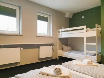 Ein Bett oder Betten in einem Zimmer der Unterkunft ARRIVEL Apartments Moosfeld - bisher Novitel