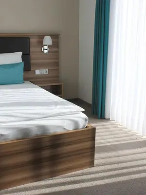 Ein Bett oder Betten in einem Zimmer der Unterkunft Gästehaus am Reisberg
