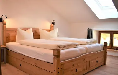 Ein Bett oder Betten in einem Zimmer der Unterkunft Ferienwohnung Thalhammer