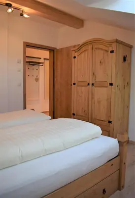 Ein Bett oder Betten in einem Zimmer der Unterkunft Ferienwohnung Thalhammer