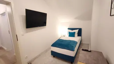 Ein Bett oder Betten in einem Zimmer der Unterkunft Homely Stay - Urban Oasis Apartments