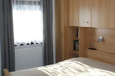 Ein Bett oder Betten in einem Zimmer der Unterkunft Ferienhaus Nr 75, Kategorie Komfort, Feriendorf Hochbergle, Allgäu