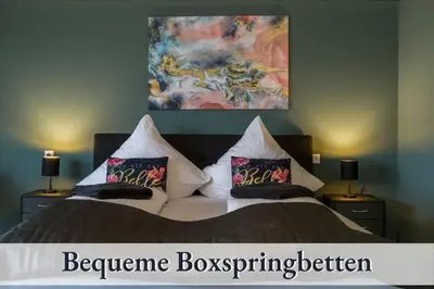 Ein Bett oder Betten in einem Zimmer der Unterkunft Relax Apartment 1302 Tolle Aussicht Massagesessel Smart TV