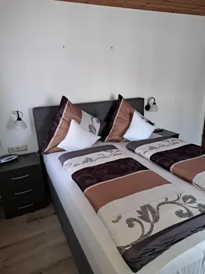 Ein Bett oder Betten in einem Zimmer der Unterkunft Ferienwohnung Rudhart