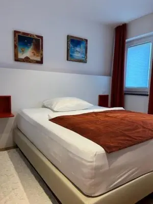 Ein Bett oder Betten in einem Zimmer der Unterkunft Baumann Suiten