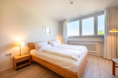 Ein Bett oder Betten in einem Zimmer der Unterkunft Mercure Panoramablick 303