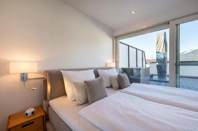 Ein Bett oder Betten in einem Zimmer der Unterkunft Mercure Alpenpanorama