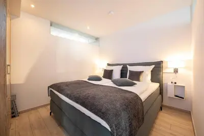 Ein Bett oder Betten in einem Zimmer der Unterkunft Mercure Alpenpanorama